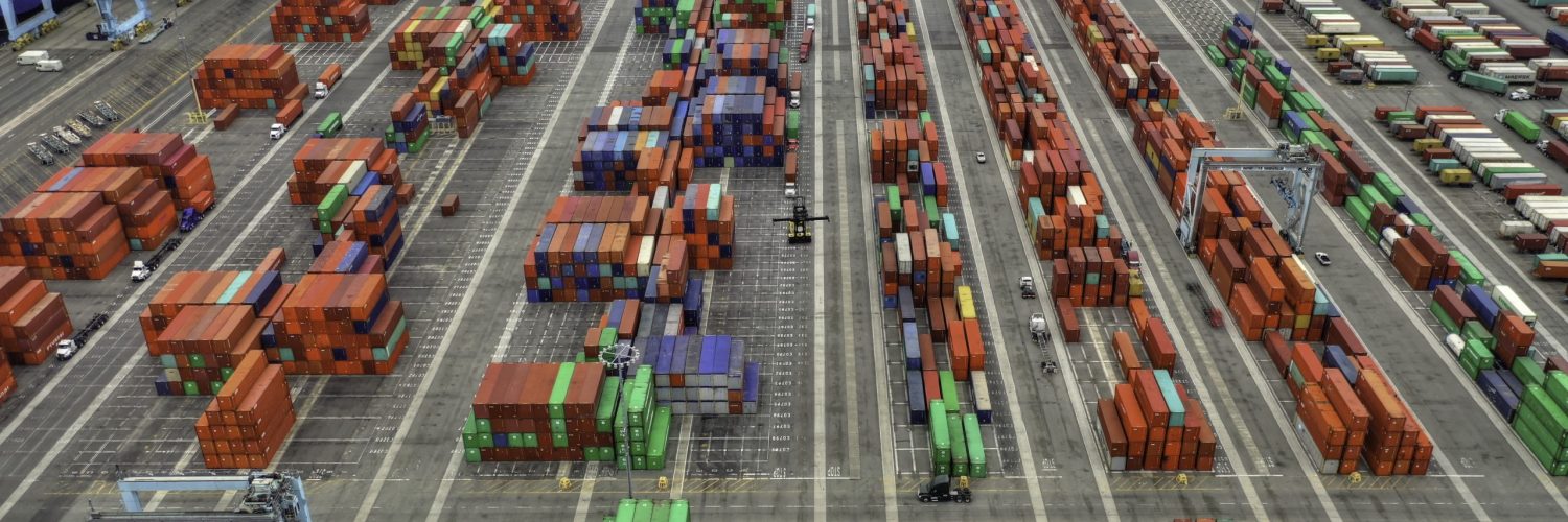 An aerial shot of large shipping containers area